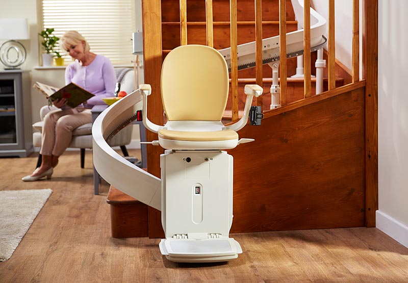 Acorn 180 chair stairlift and rail on a staircase with a turn